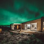 Soak in your personal wood-fired hot tub in a luxury cabin on an adrenaline-filled Iceland adventure (photo courtesy of Hrifunes Nature Park)