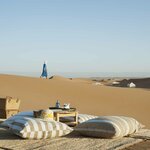 Settle into your Azalaï Desert Camp in the hollow of the Chigaga dunes