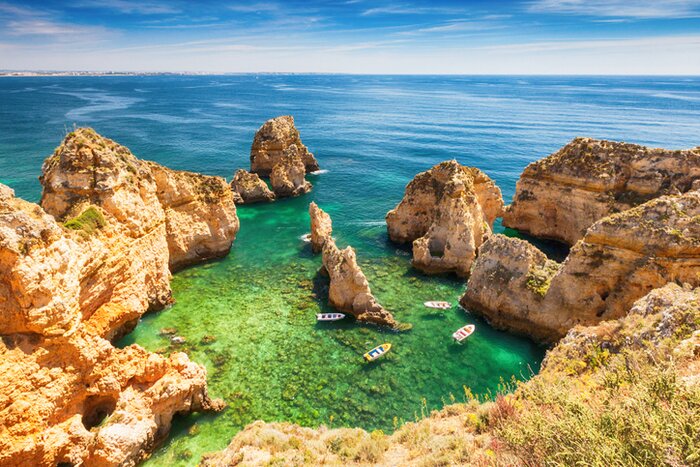 Drive south to the cliffs and beaches of the Algarve before crossing into Spain