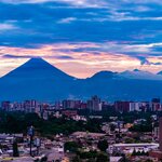 Enjoy sights like Volcán de Fuego outside of Ciudad Vieja, Guatemala City