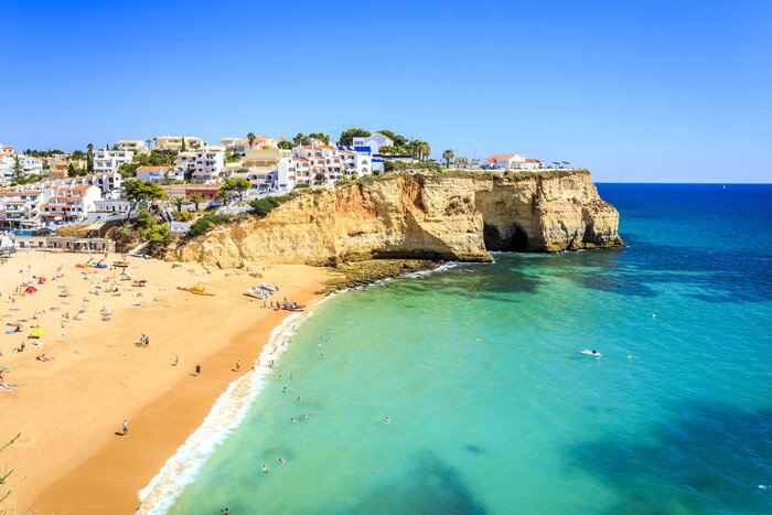 See golden beaches and cliffside towns like Carvoeiro in the Algarve