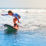Combine rainforest hikes and volcano views with beach time and surfing adventures on this six-day family trip