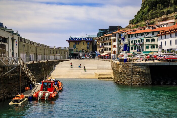 Colorful fishing boats on La Concha bay in San Sebastian