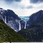 Hike a flat trail to see views of the Glaciar Colgante (Hanging Glacier) while staying in Puyuhuapi
