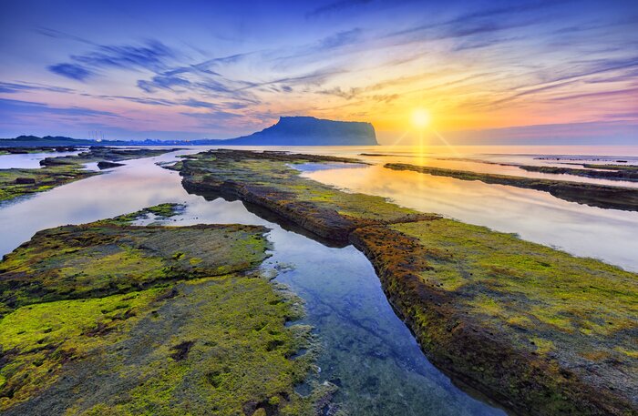 Wake early to take in the rising sun at Seongsan Ilchulbong ("Sunrise Peak") on Jeju Island