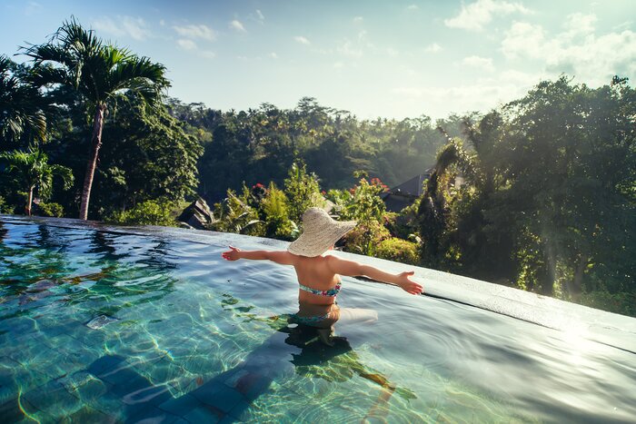 Soak up your idyllic surroundings from an infinity pool during a one-week luxury tour in Indonesia