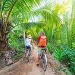 Bike along the canals of the Mekong Delta during your overnight cruise