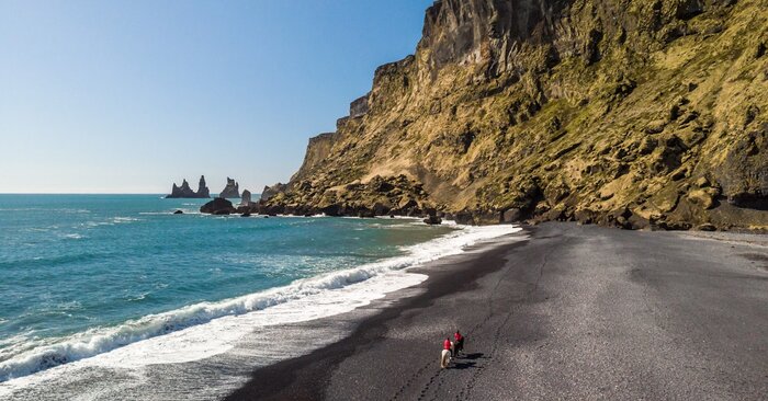 Horseback riding on the black sand beaches