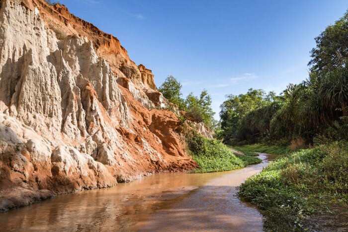 Visit Suoi Tien or "Fairy Stream" in Mui Ne, where a small river divides rock and jungle