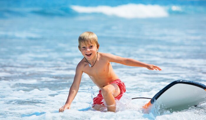 Take the kids to the beach to surf