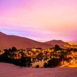 Spend your last night of the trip in Huacachina, a desert village surrounded by sand dunes