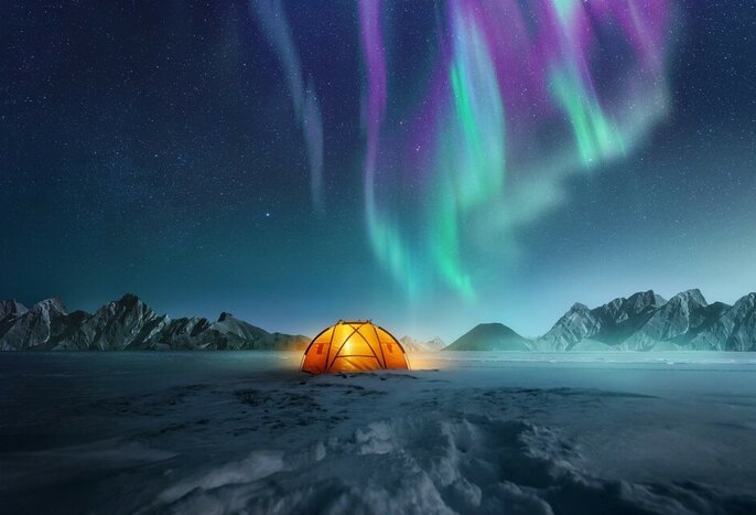 Travel to the top of the world for two weeks of winter adventures and northern lights viewing