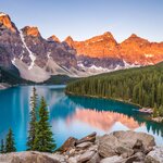 If you can, get in an early morning to watch the sun rise over Lake Moraine at Banff National Park
