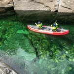 Paddle an inflatable canoe on the Raundal River near Voss