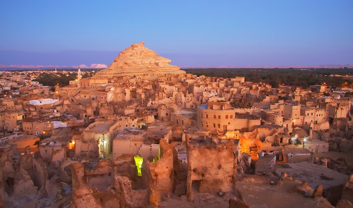 Visit the mud-brick Shali Old Town, an ancient Berber settlement in the Siwa Oasis