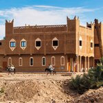 Enter the Rissani kasbah and find the donkey "parking lot"