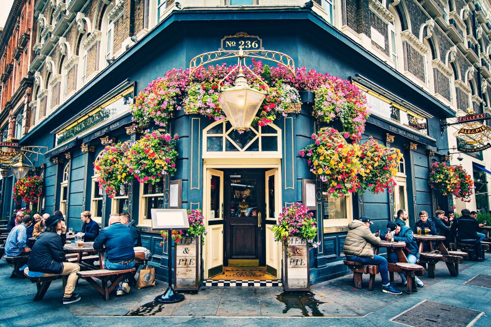 Old traditional English Pub , Brewery, Pub entrance decorated with flowers in Central London,