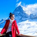 A woman soaks up the views on the Jungfrau railway route
