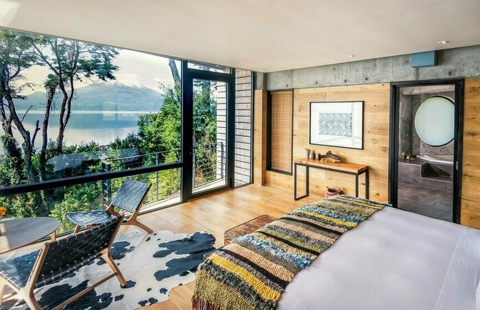 Relax from your contemporary accomodation on a luxury getaway to Puerto Varas and admire Lago Llanquihue and Osorno Volcano views (photo courtesy of Hotel AWA)