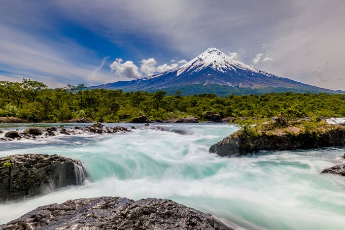 Discover Petrohué Waterfalls with snow-capped Osorno Volcano in the background on an itinerary to Central Chile