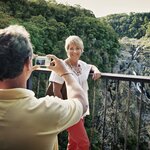 Take photos on the Kuranda Scenic Railway