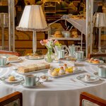 Afternoon tea is served on the hotel's signature jade-and-white-striped bone china (photo courtesy of Claridge's)