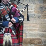 A Scot plays the bagpipes in Edinburgh
