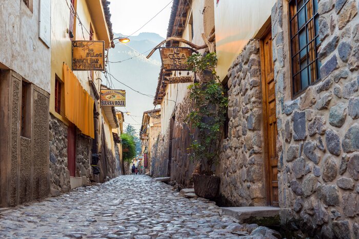 Walk through ancient streets in Ollantaytambo, located in the Sacred Valley