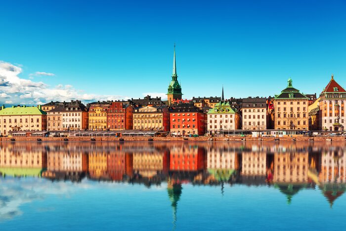 Stockholm's colorful Gamla Stan (Old Town) reflected in the archipelago waters
