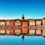 Stockholm's colorful Gamla Stan (Old Town) reflected in the archipelago waters