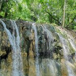 Head to the Río Dulce for a boating excursion and swim beneath waterfalls