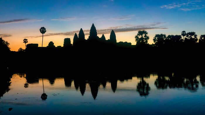 Wake early to catch Angkor Wat at sunrise