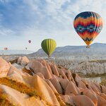 Sail high above Turkey's iconic Cappadocia on a sunrise hot air balloon tour