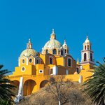 Our Lady of Remedies church and palm trees in Cholula, Mexico