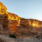 The walls of Sesriem Canyon, Nambia, illuminated by the setting sun