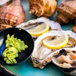 Sample gourmet Japanese foods, such as Takehara's oysters at Suzuki Farm on a art and culture tour of Eastern Setouchi