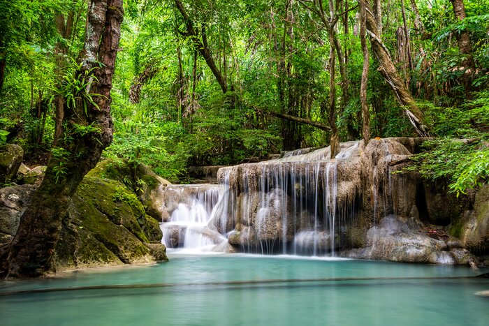 Take a hike through Thailand's national forest to cool off at the Erawan Waterfall