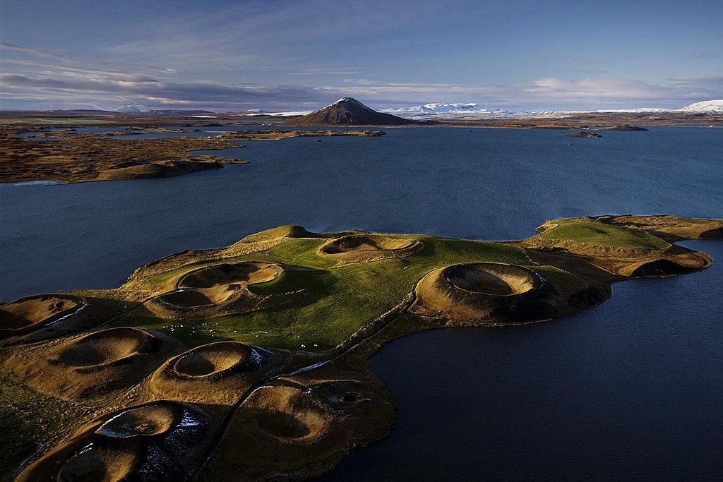 Iceland, The Lake Mývatn region features otherworldly landscapes like pseudocraters