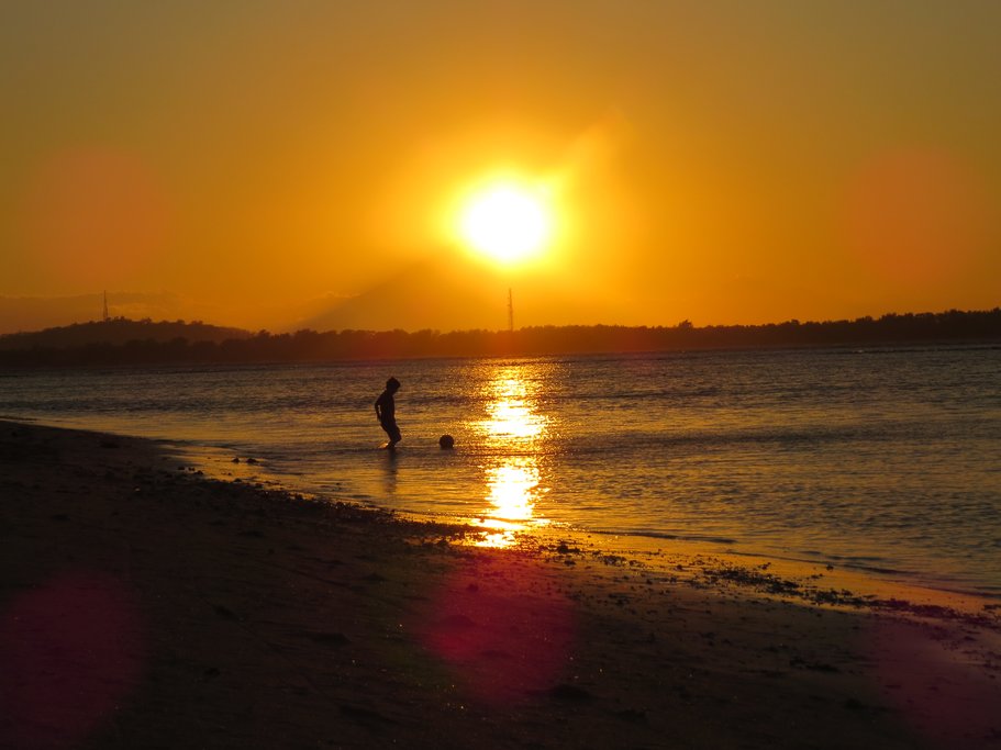 Watch the sunset over the Gili Islands