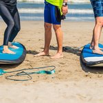 Meet your professional surf instructor for a day of catching waves