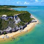 Soak up the sun on Praia do Espelho while you wait for the natural pools to form