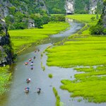 Board a sampan boat and sail through the winding rivers of the Ninh Binh province 