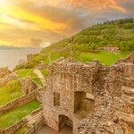 Ruins of Urquhart Castle sit quietly alongside Loch Ness