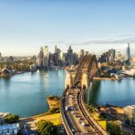 Arch of Sydney Harbour bridge with highway leading across the Sydney Harbour to Sydney