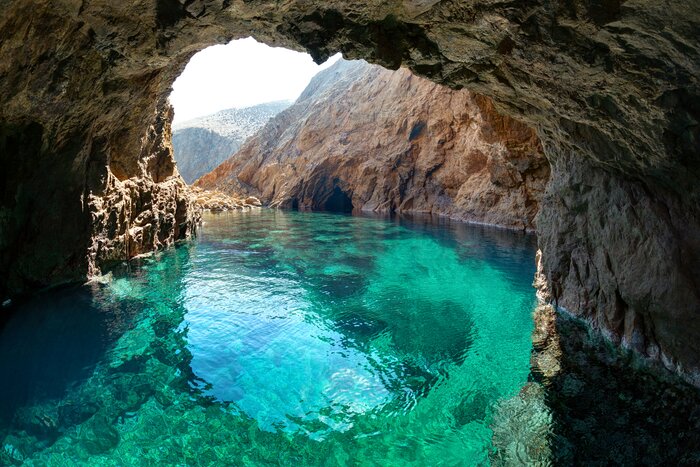 Hire a boat in October to explore the network of Tragonisi sea caves, just off of Mykonos