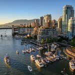 Admire the glittering Vancouver skyline, reflected in the Pacific Ocean