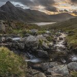A dramatic fall sunset of Llyn Ogwen and Tryfan in Snowdonia National Park, Wales
