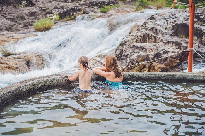 Relax in natural hot springs warmed by a volcano