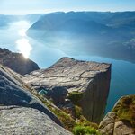 An autumn hiker at one of Norway's famous views from Pulpit Rock 