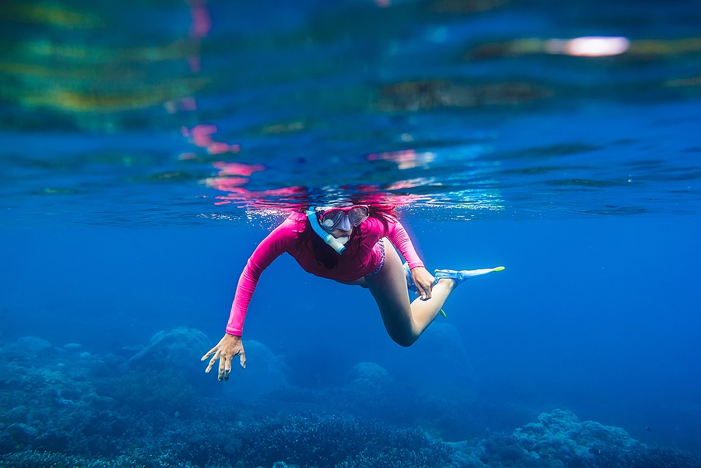 Snorkeling in the crystal-clear waters around Manuel Antonio.